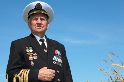 A senior man in uniform, cap, ordens and medals
